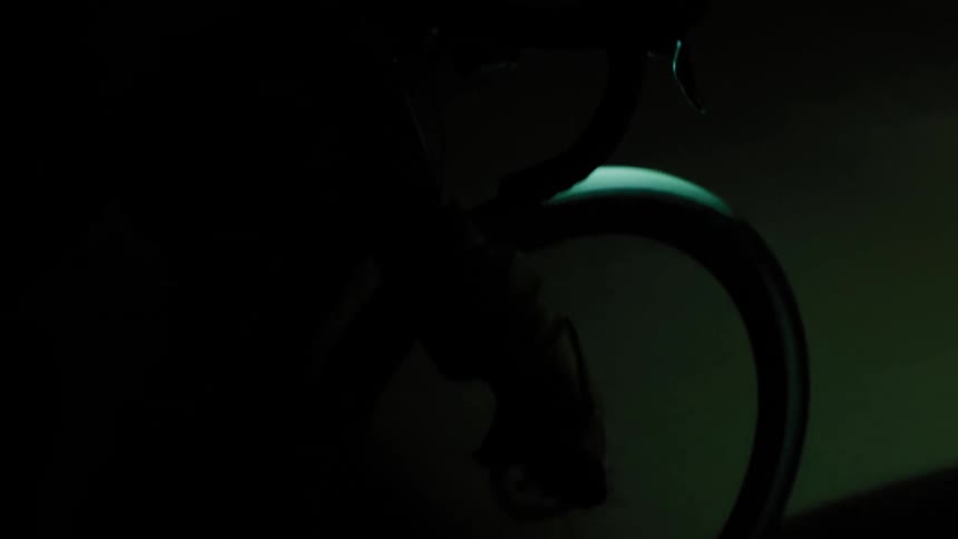 A person is riding their bike at night