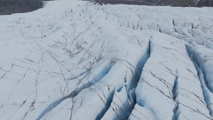 Fissures in a mountain covered in snow and ice
