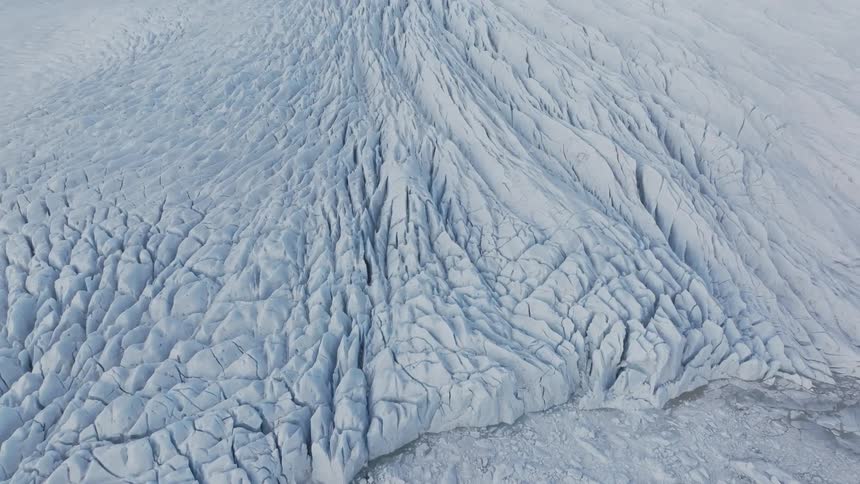 Aerial panorama of an arctic mountain covered in ice and snow