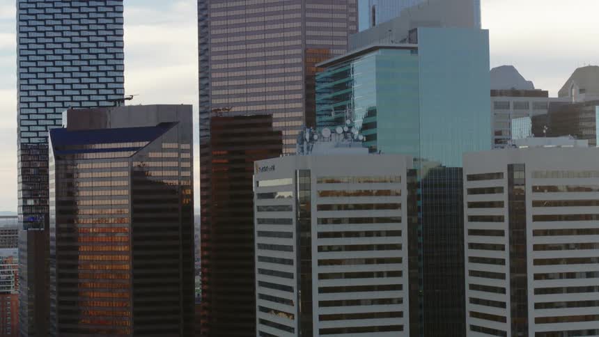 Rising up to see glass buildings reflecting during the day