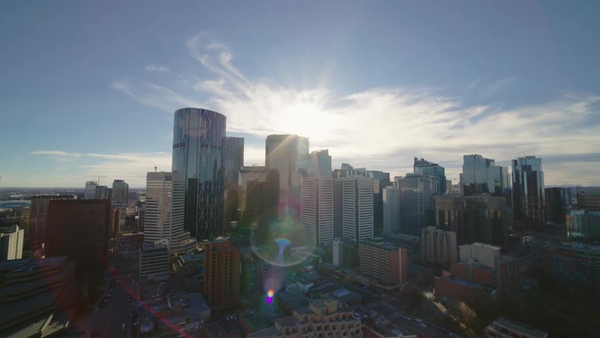 Aerial panorama of a metropolis with modern skyscrapers and the reflection of sunlight during the day