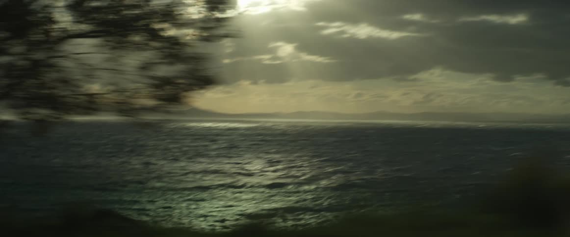 The ocean is seen on an overcast day