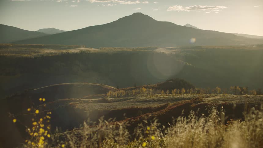 Landscape of ruins and mountains with morning sun reflection