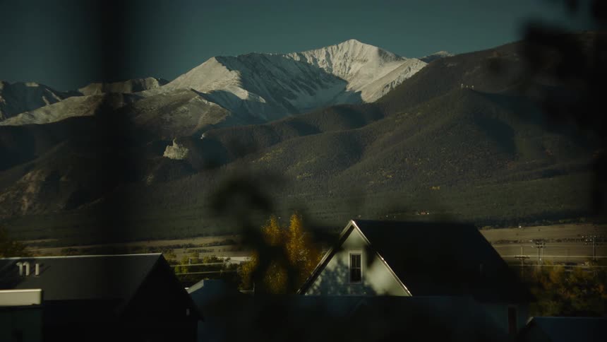 Houses of a rural villa near a mountain range
