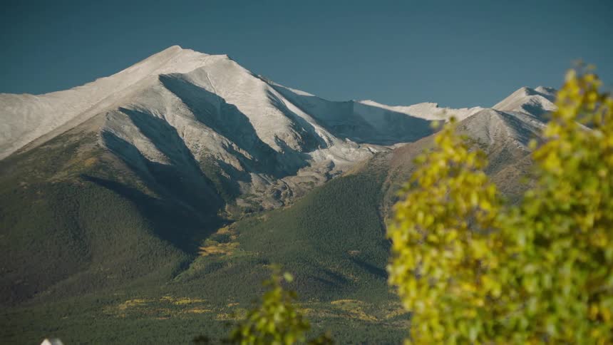 Landscape with mountains with vegetation and snowcovered peaks