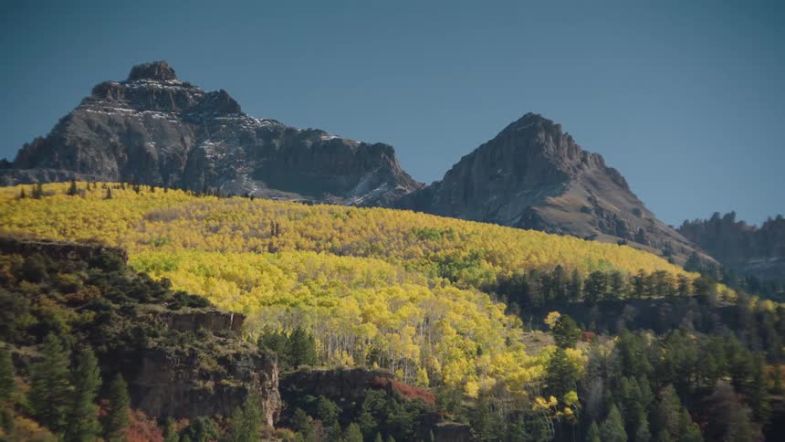 Landscape of hills in forests and mountainous peaks