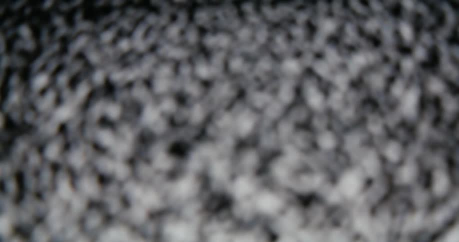 Close up of black and white static on a screen