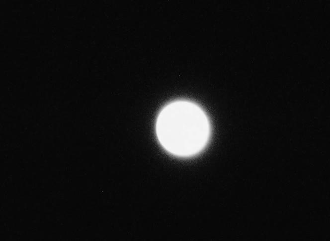 Abstract moon against a dark sky in zoom movements
