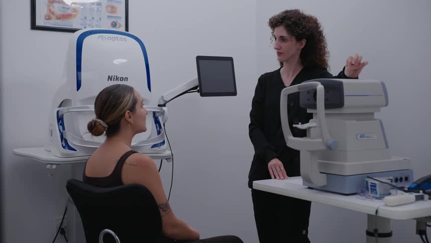 An ophthalmologist gives a patient an eye test