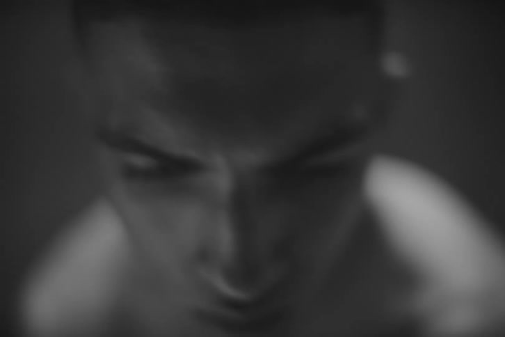 Portrait of a man without a shirt with a tired facial expression