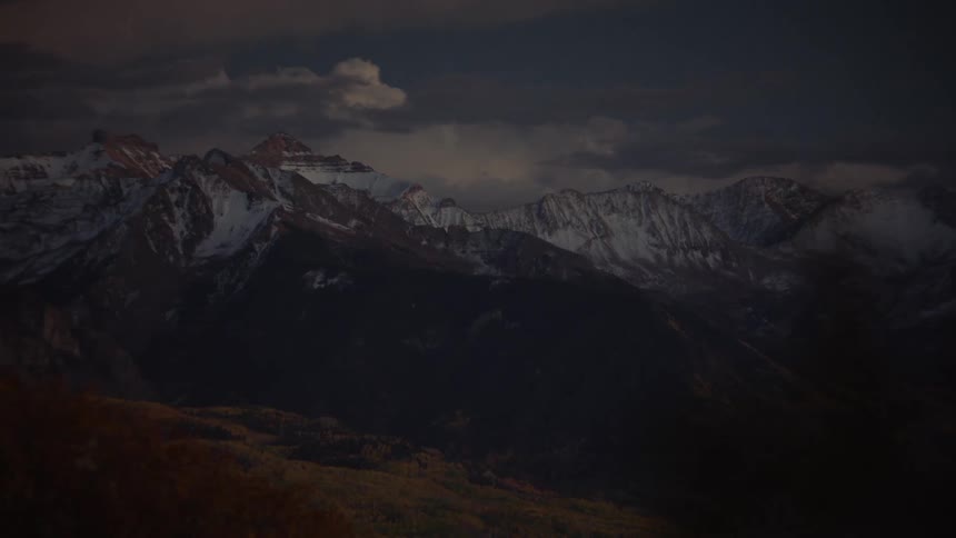 The tips of the mountains are covered in snow