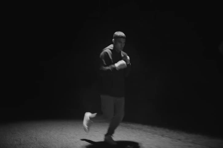 Boxer running and practicing on a road at night