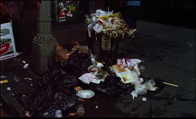 Sidewalk of a metropolis full of trash