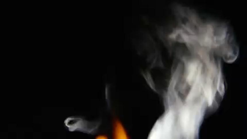 Fire and smoke against a dark background