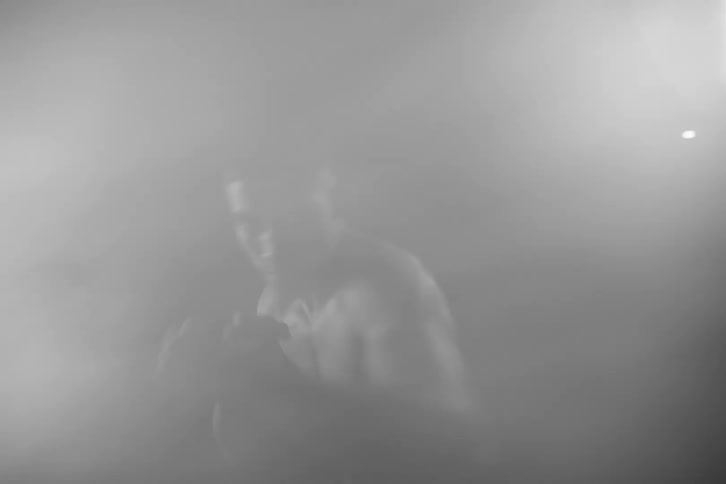 Shirtless man doing boxing movement