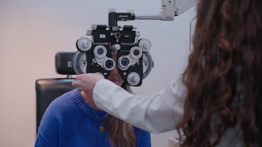 A woman is getting an eye exam