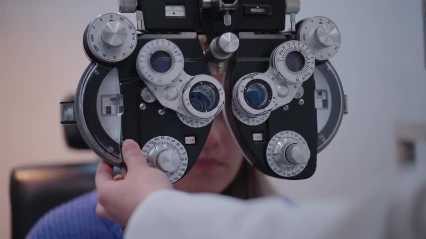 Vision testing machine being placed on a patients face