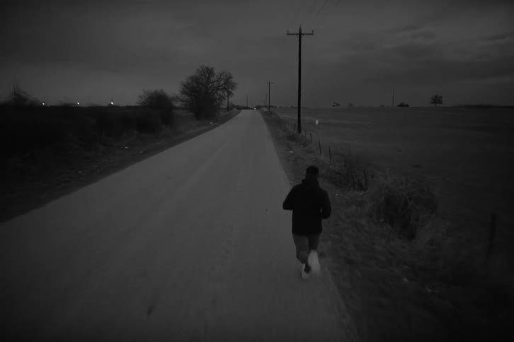 A man is running down the road