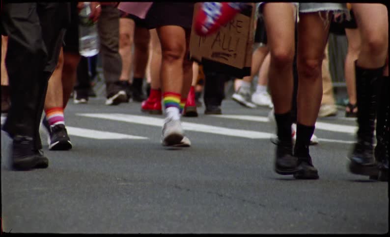 A group of people walking on a street