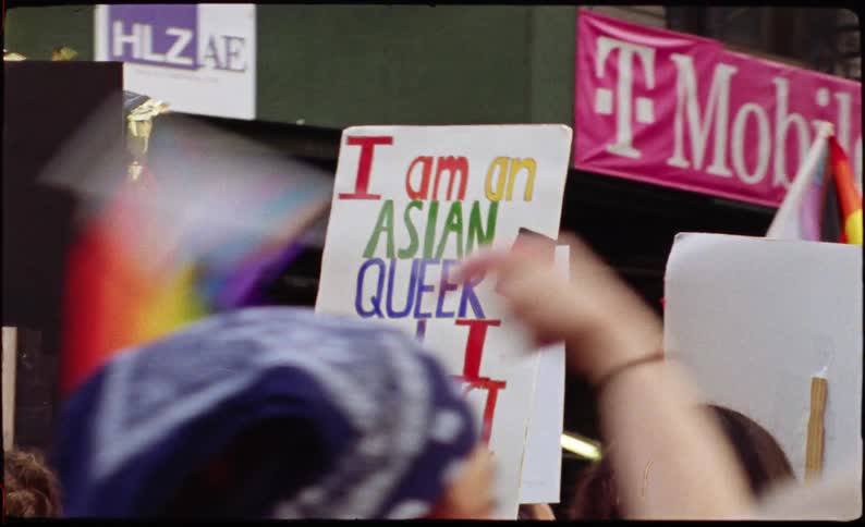 Crowd of people demonstrating with posters in favor of homosexuality