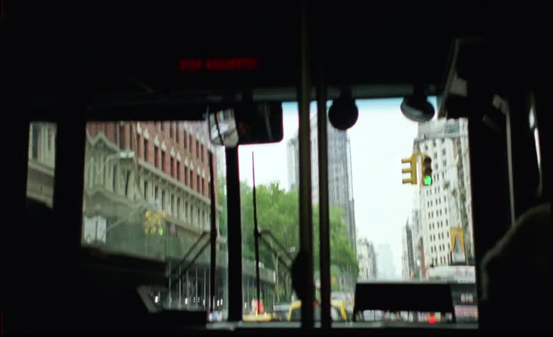 The interior of a bus driving in the city