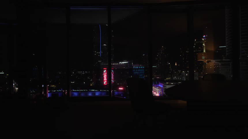 Illuminated skyscrapers seen from a windows in the city