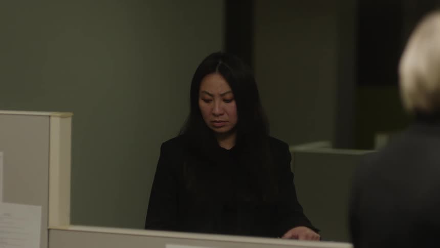 Portrait of a woman making a disgusted facial expression while leaving an office room