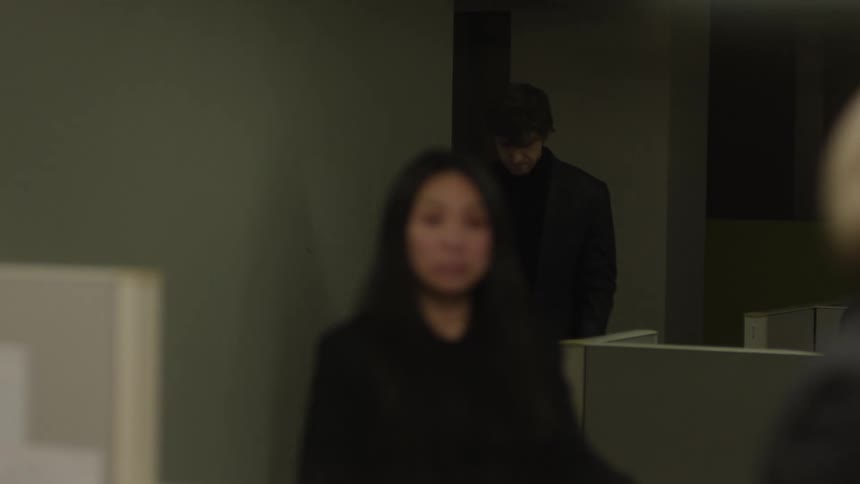 Man entering an office room with a woman