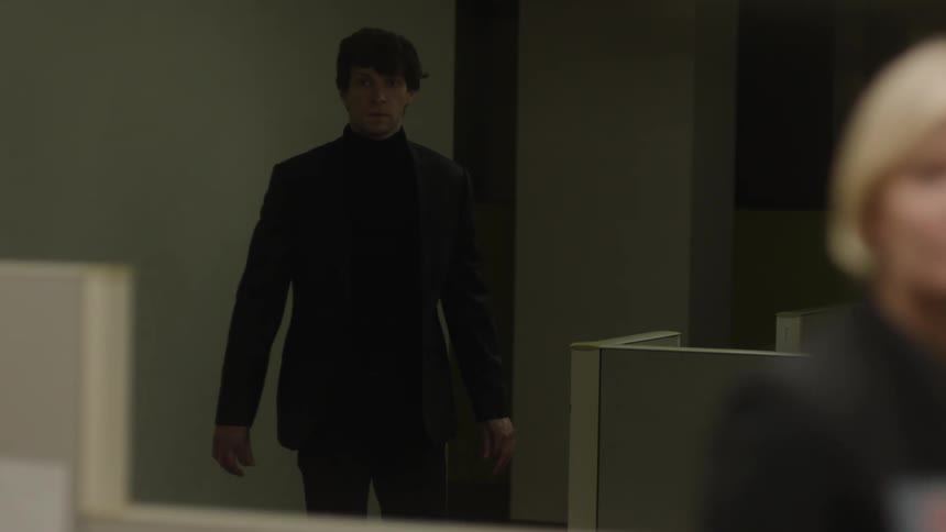 A man walks into the office and looks nervous