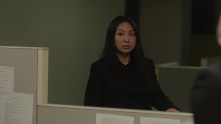 A woman is listening in the office