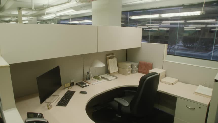 Office table with a chair and a computer in a bright room