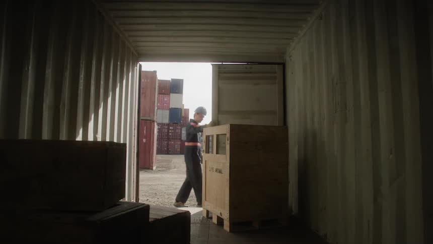 An employee opens a storage unit