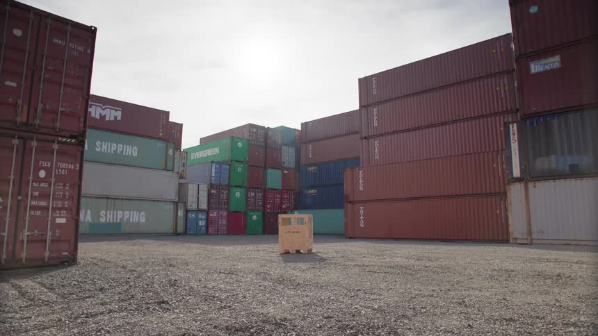 A lot of shipping containers sitting in a yard