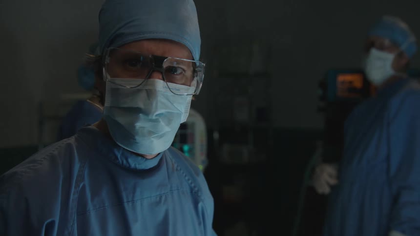 A surgeon seemingly panics in an operating room