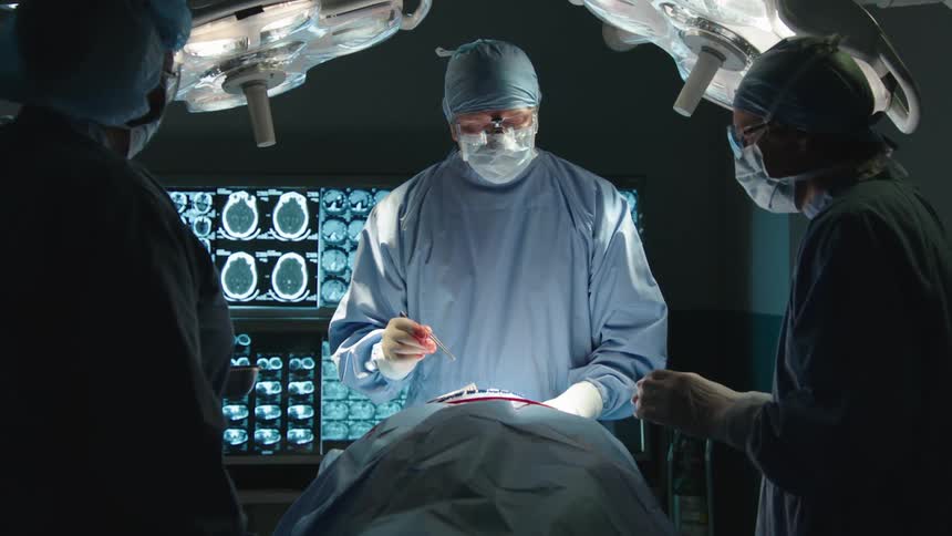 A surgical team performs an operation