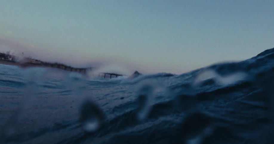 A person is riding a wave on their surfboard