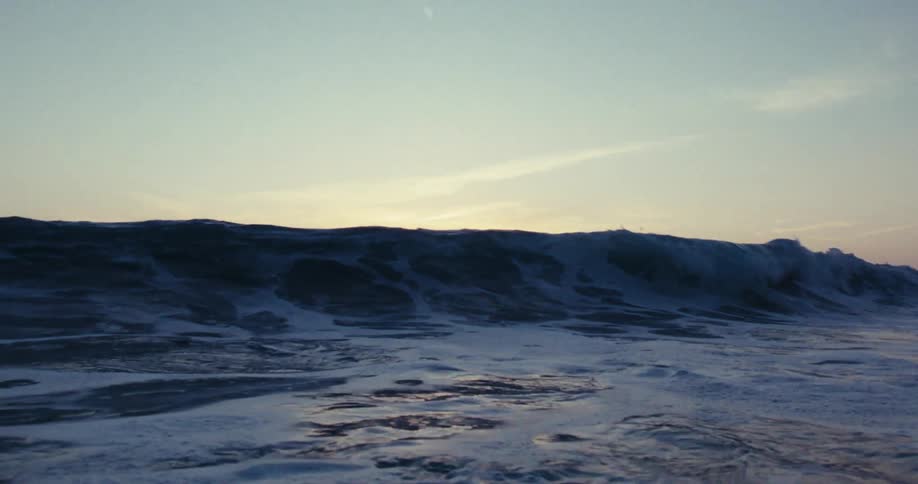 A wave crashes in the ocean