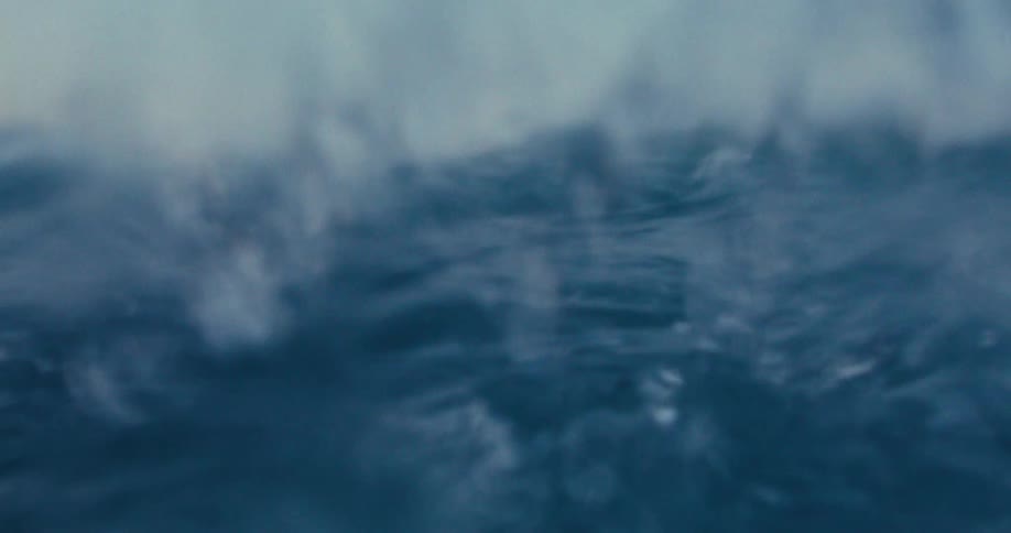 Ocean waves splashing on the camera