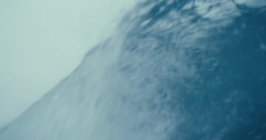A huge wave crashes in the ocean