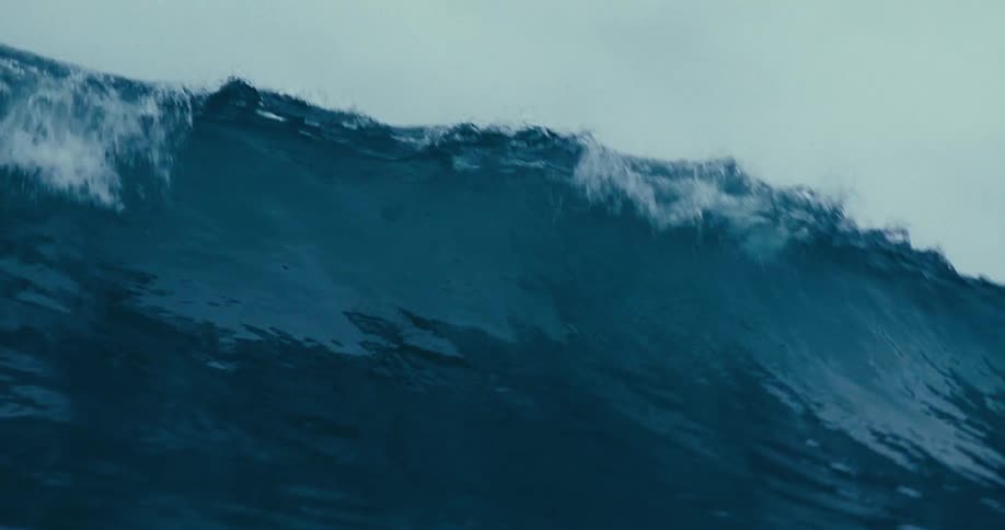 Ocean wave breaking on a cloudy day