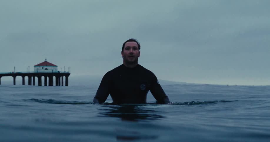 A surfer in the sea waiting for a wave