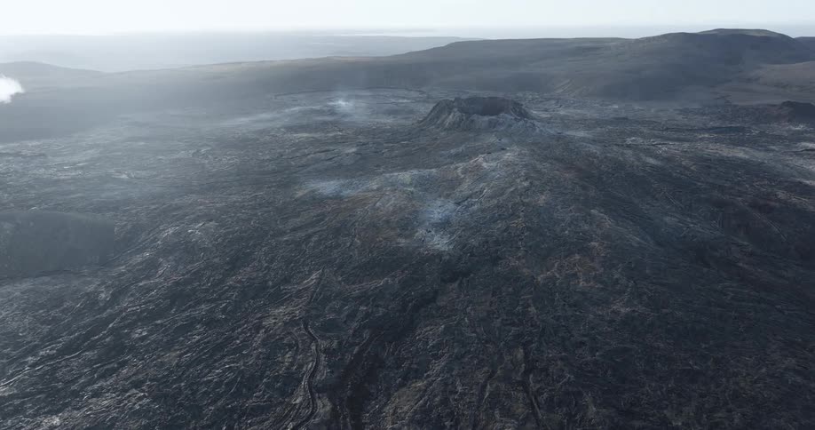 Aerial panorama of craters and a volcano in a morning
