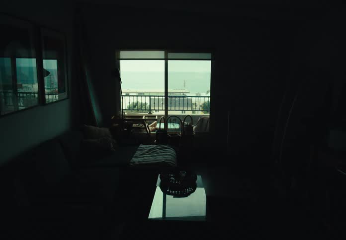 Living room of a dimly lit beach apartment