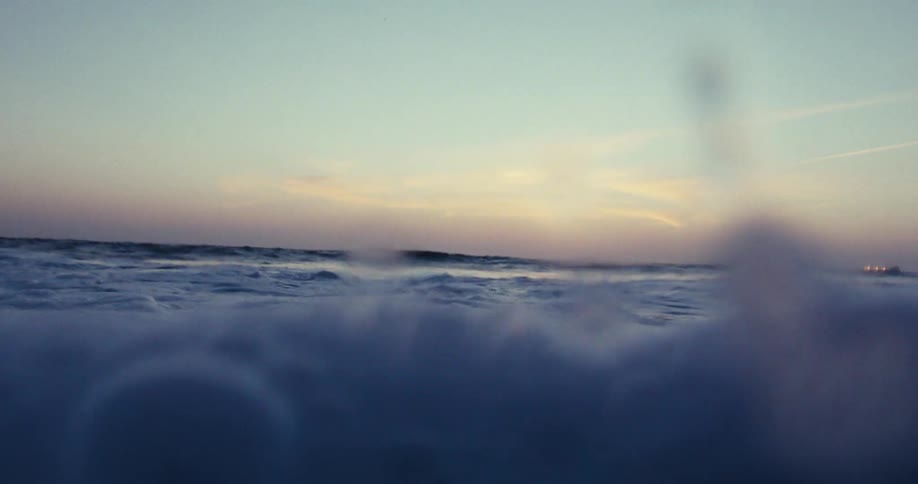 The ocean roils off of a coastal area