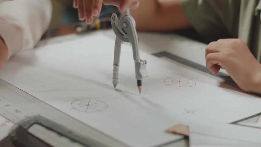 A man and a boy drawing circles