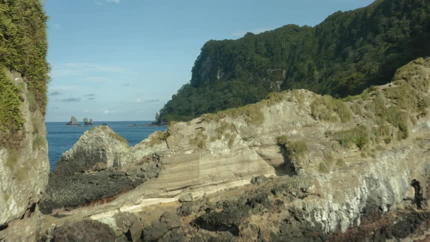 A sea coast in a land with various coastal rocks