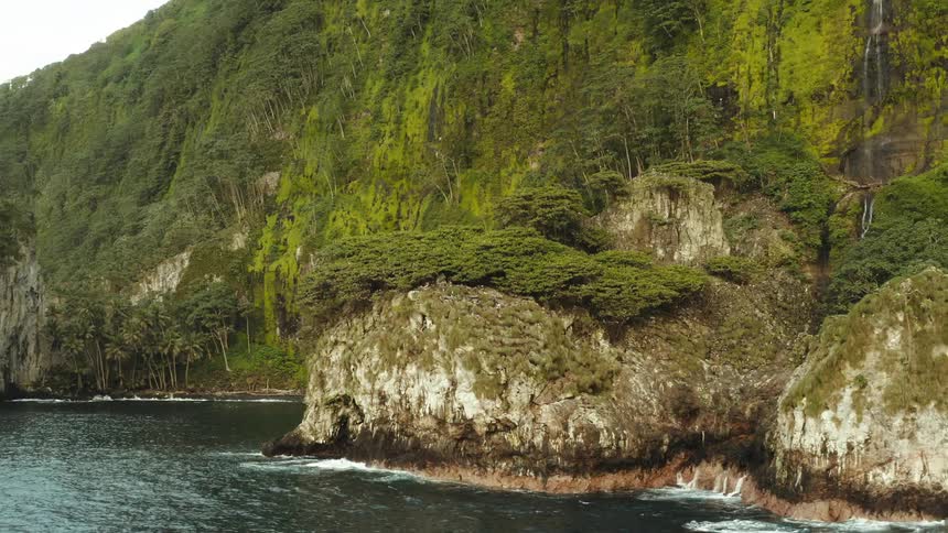 Aerial panorama of a rocky crust with erosions and wooded seaside