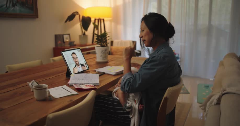 A man and woman are having a video call on a tablet