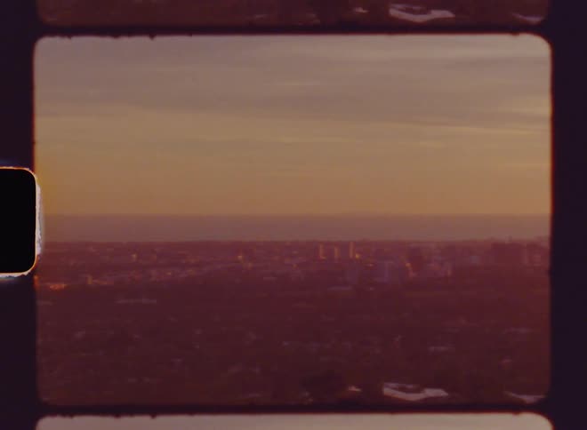 Panoramic view of a metropolis with urban areas and skyscrapers in a late afternoon sky