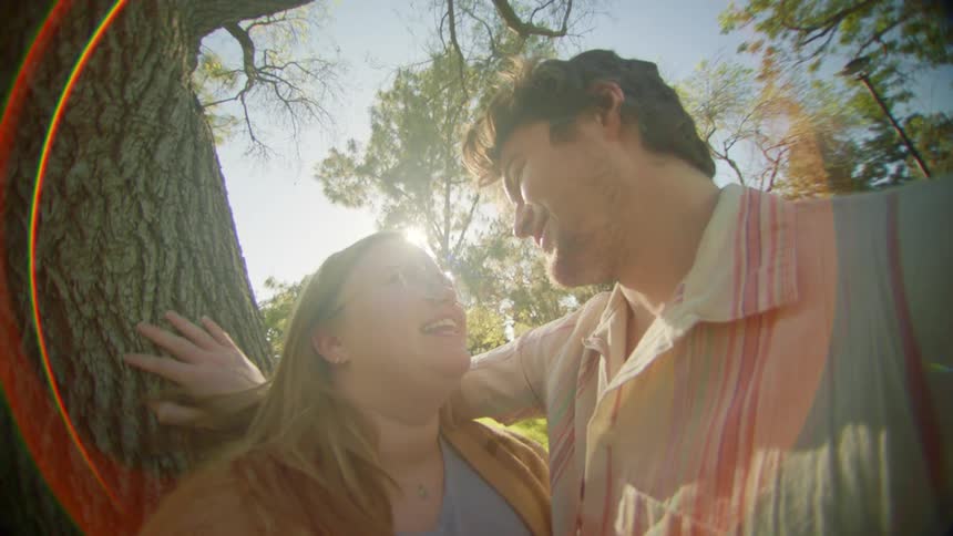 A man and woman look lovingly at one another